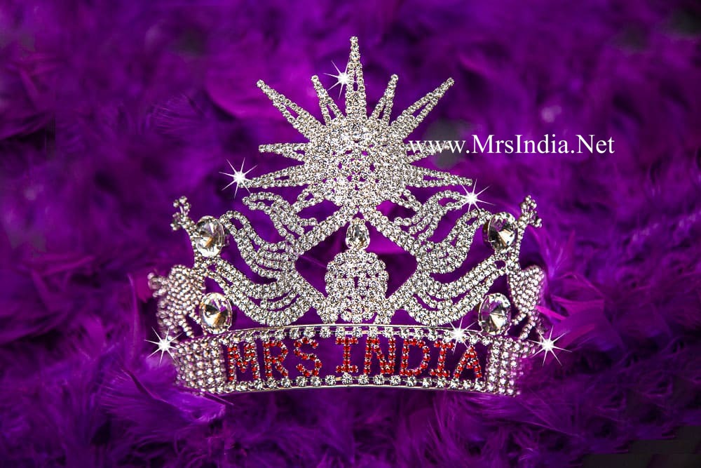 Official Mrs India crown on purple feather background